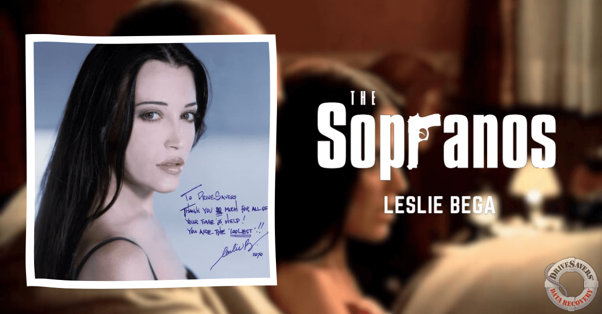 It sounds like you have a signed photograph featuring Leslie Bega, known for her role in "The Sopranos." The photo includes a personal message addressed to Bruce, and Leslie Bega's signature. Her long dark hair and the presence of "The Sopranos" elements in the background highlight her connection to the popular TV series. This makes it a memorable piece for any fan of the show or admirer of Leslie Bega's work.