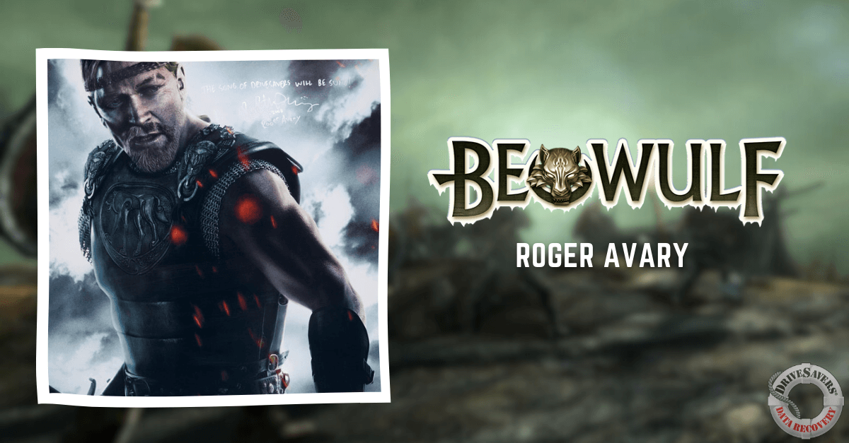 The image features a warrior clad in armor, exuding a fierce determination. The backdrop depicts a battle-like scene with a greenish hue, adding to the intense atmosphere. Notably, the name "Beowulf" and "Roger Avary" are prominently displayed alongside the warrior. Additionally, in the corner of the image is a logo that hints at themes of adventure and conflict.